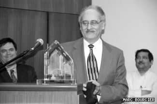 At his farewell party, Nabil Esmail (above), was given a plexiglass sculpture etched with an image of the Engineering, Computer Science and Visual Arts Integrated Complex, commonly called the EV Building. 